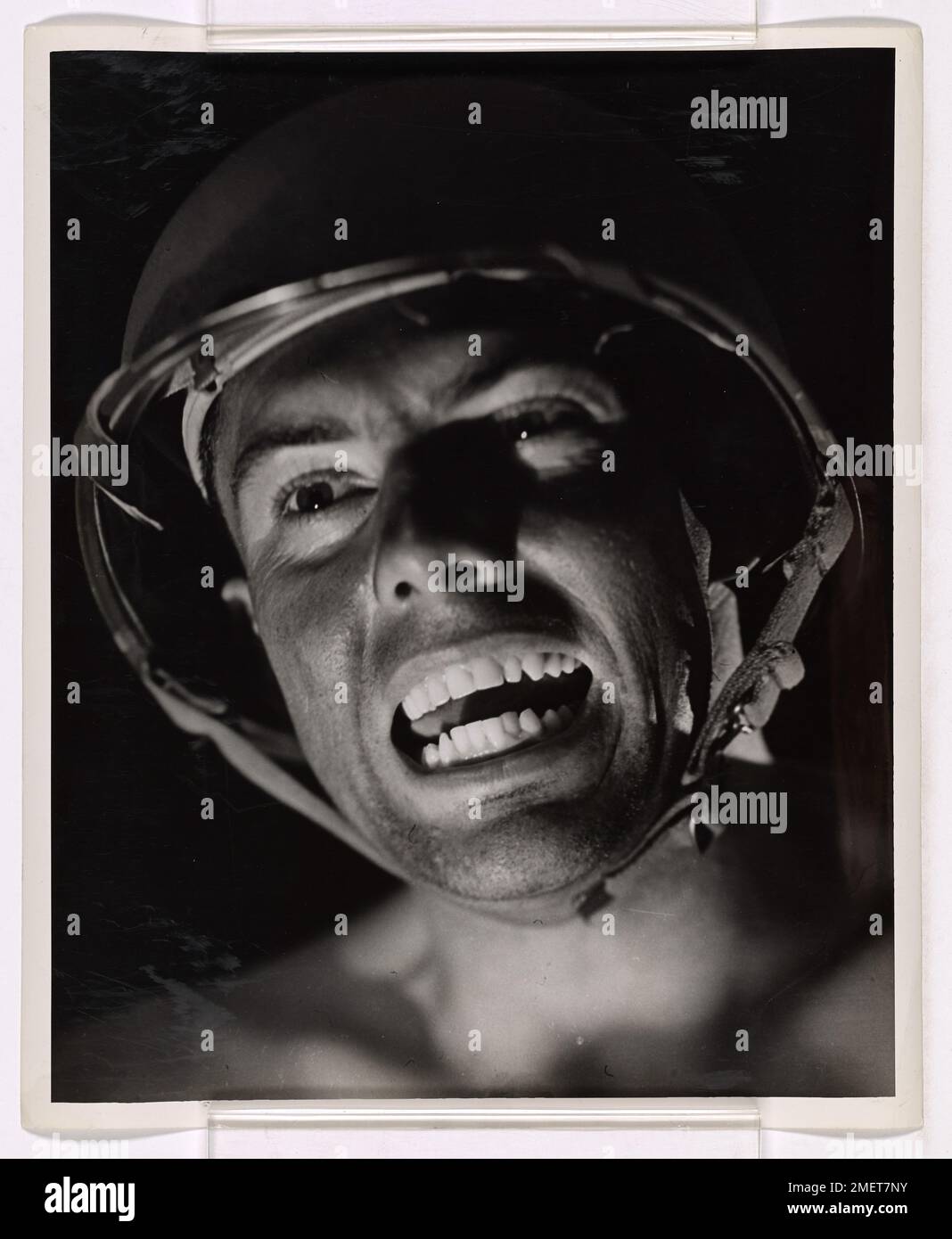 A Coast Guardsman displays a fierce expression as he symbolizes the ...