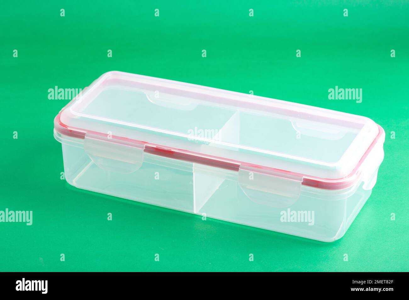 Multipurpose Plastic Container With Airtight Lid; Photo On Green Background. Stock Photo