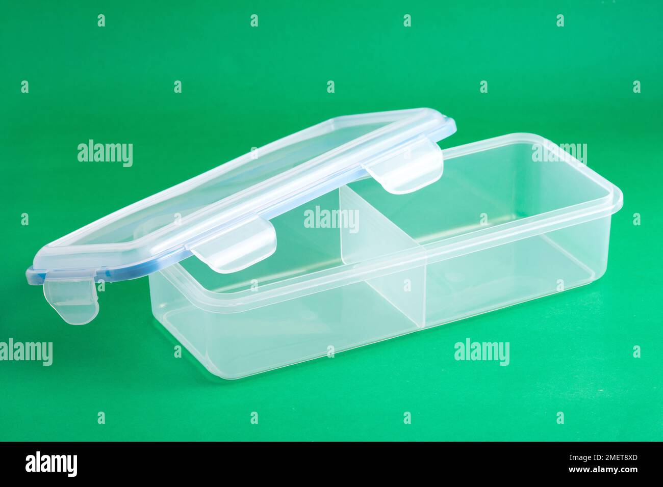 Multipurpose Plastic Container With Airtight Lid; Photo On Green Background. Stock Photo