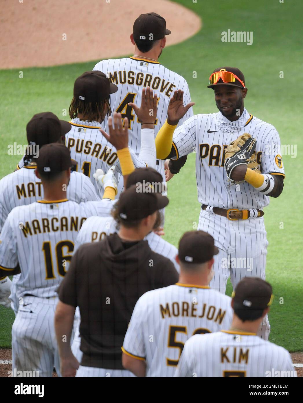 San Diego Padres players congratulate one another after the Padres defeated  the Arizona Diamondbacks 7-0 in a baseball game Saturday, April 3, 2021, in  San Diego. (AP Photo/Denis Poroy Stock Photo - Alamy