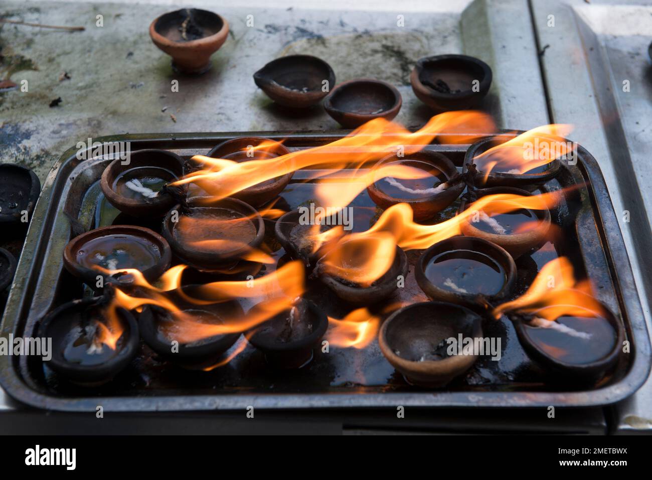 Burning Coconut Oil, Colombo, Gangaramaya Temple, Lighting the Lamps