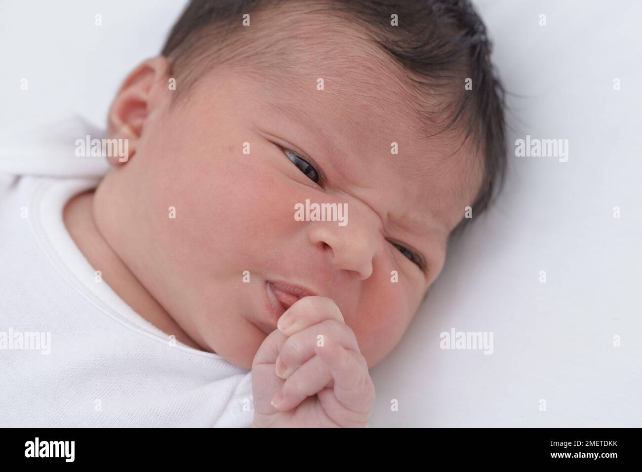 Baby girl pulling a face Stock Photo Alamy