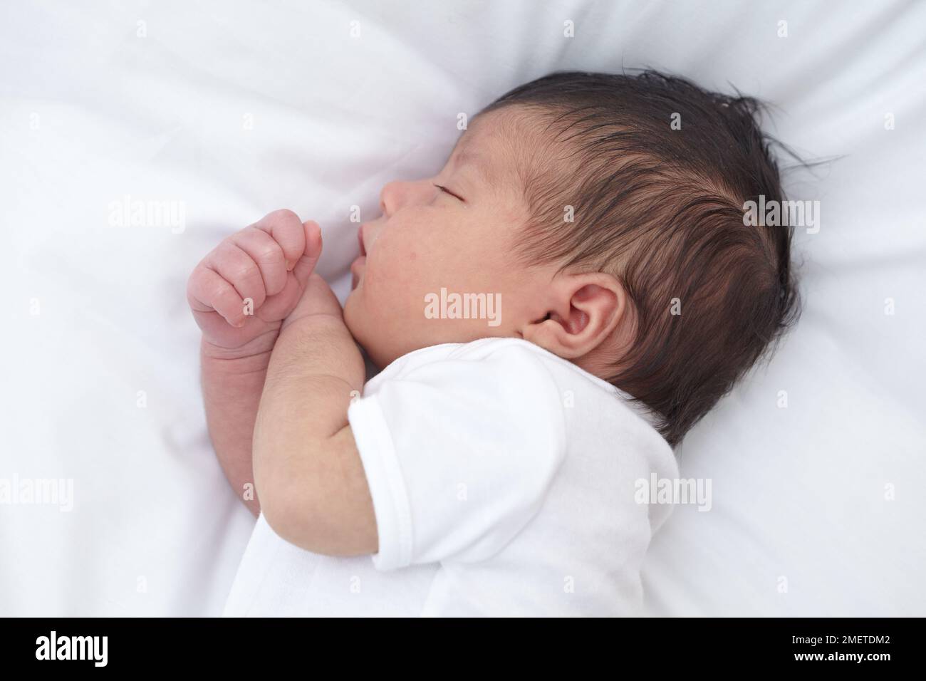 Baby girl lying on side, sleeping Stock Photo Alamy