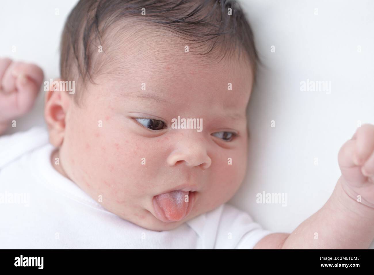 Baby girl sticking out her tongue Stock Photo Alamy