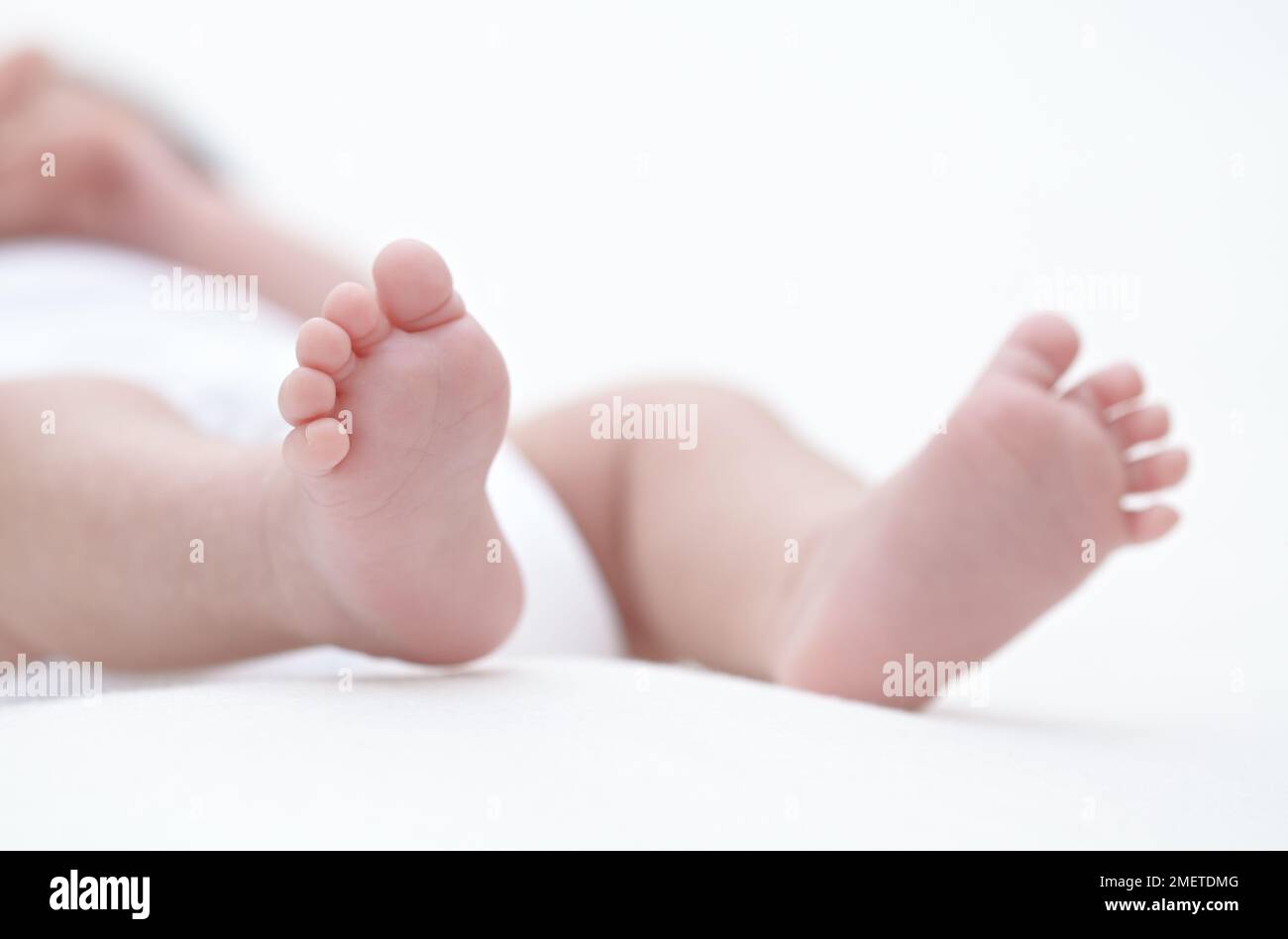 Feet of baby girl Stock Photo - Alamy