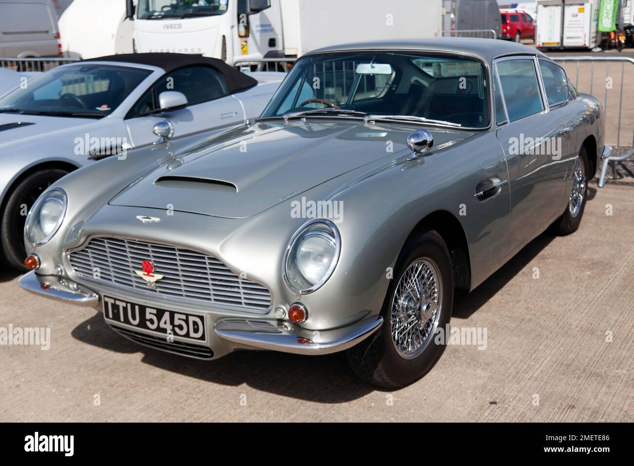 Three-quarters Front View of a  Silver, 1966, Aston Martin DB6, on display in the Aston Martin Owners Club zone, at the 2022 Silverstone Classic Stock Photo