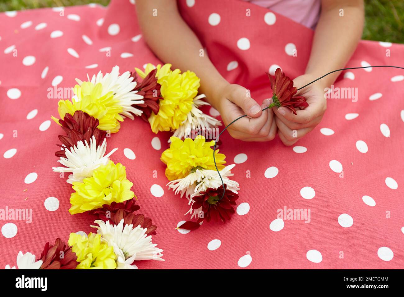 Making flower garland Stock Photo