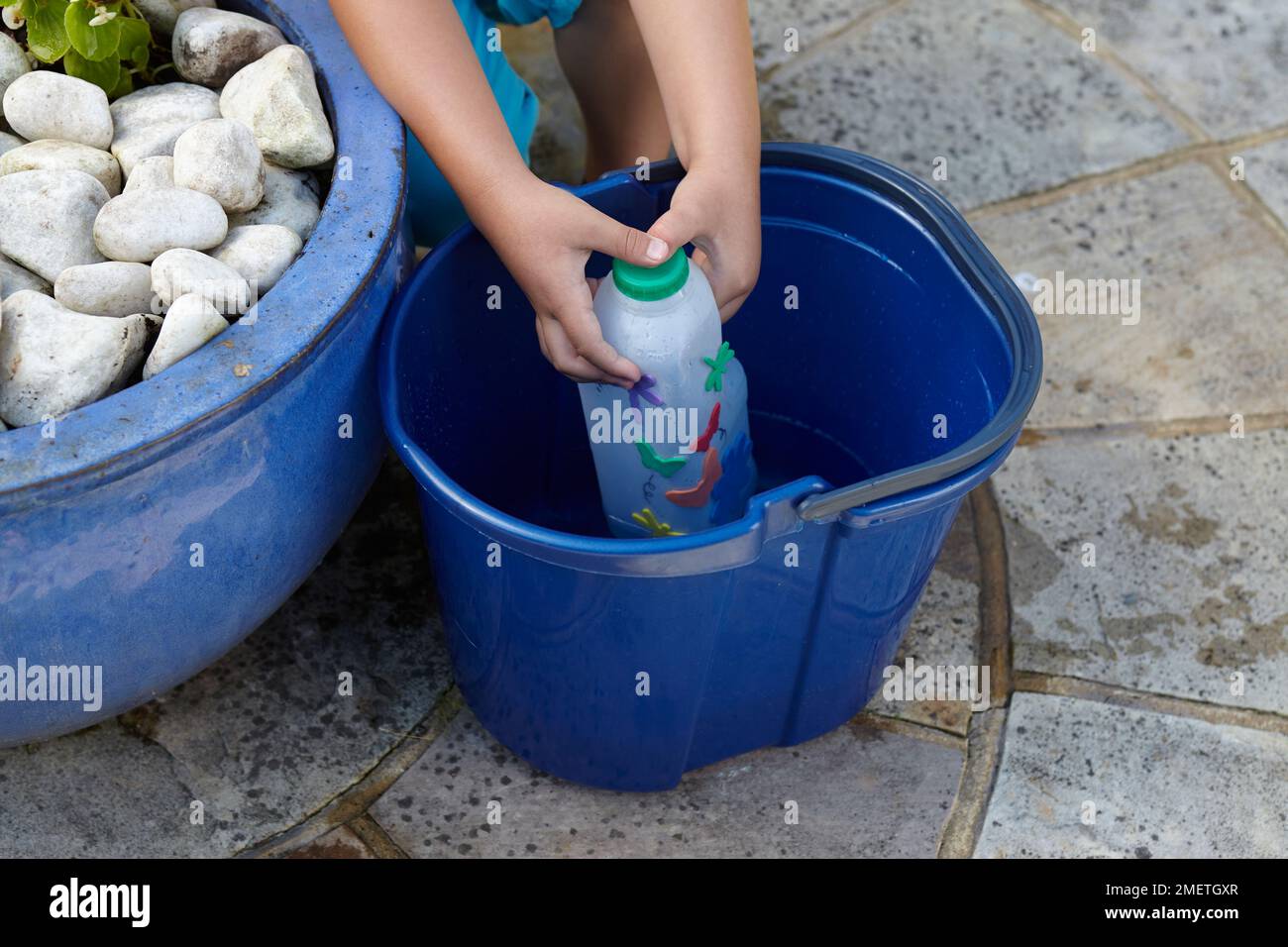 Making watering can out of recycled milk bottle Stock Photo Alamy