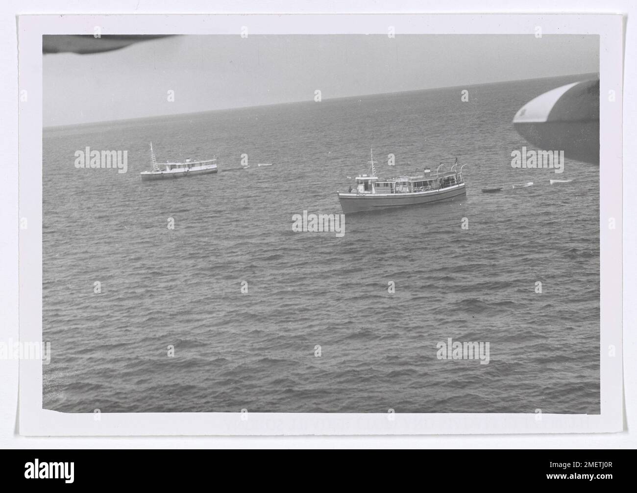 Photograph of Andros Trader (top) & Madam Elizabeth Near Bimini. This image is one of a set of photographs taken of the fishing vessels involved in a shooting incident 12 March near Bimini. These photos were not released as no Coast Guard action was involved and the vessels were Bahamian and Cuban. The photos were shot with a K-20 aerial camera by an air crewman, and not by one of the rated photographers assigned. Stock Photo