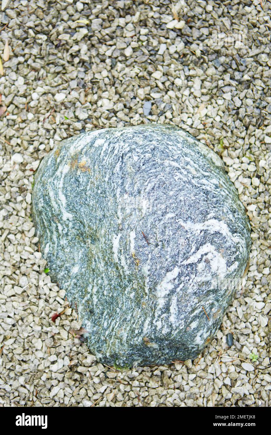 Stone on gravel path Stock Photo - Alamy