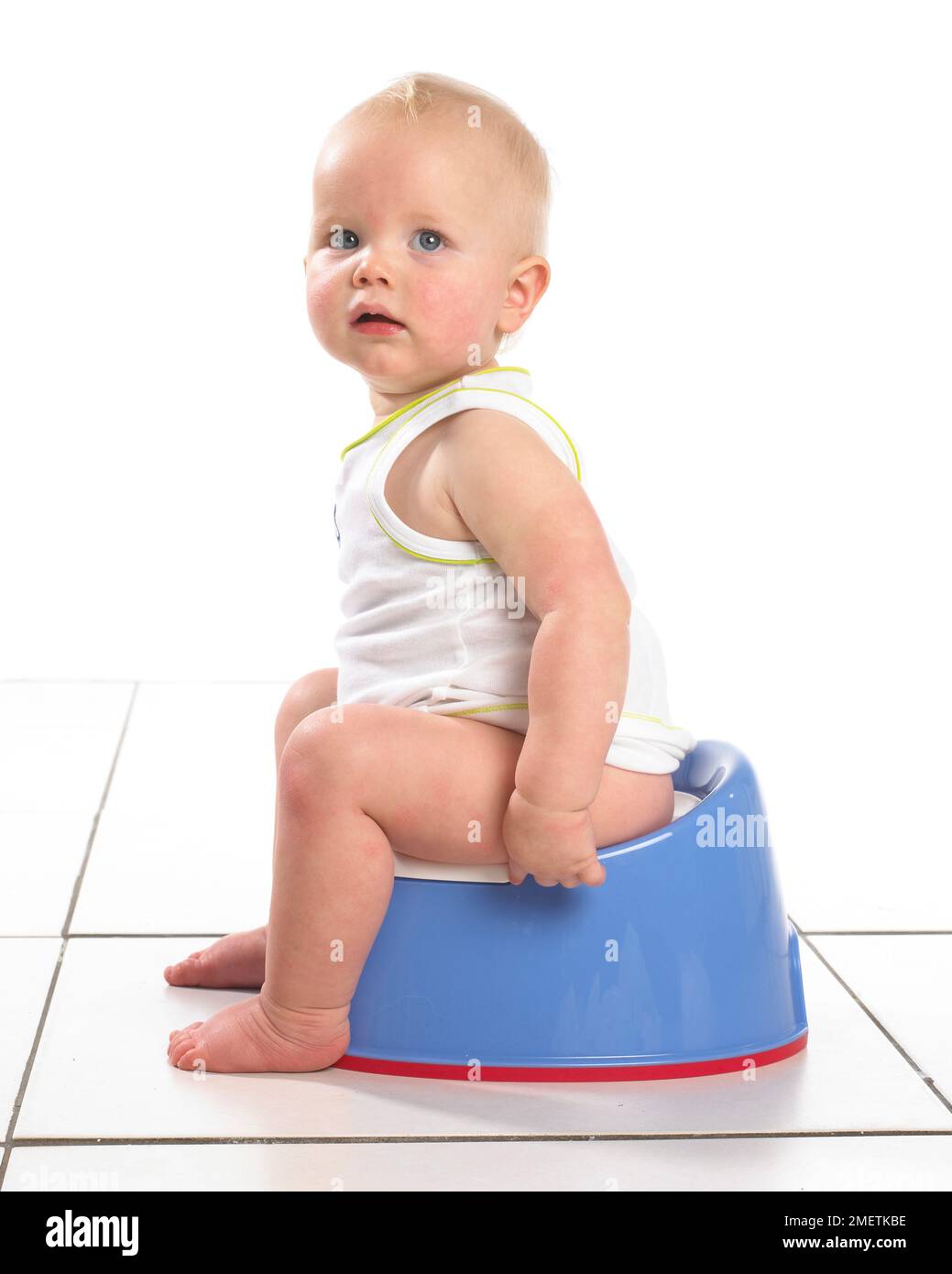Boy wearing vest sitting on blue potty, 15 months Stock Photo - Alamy