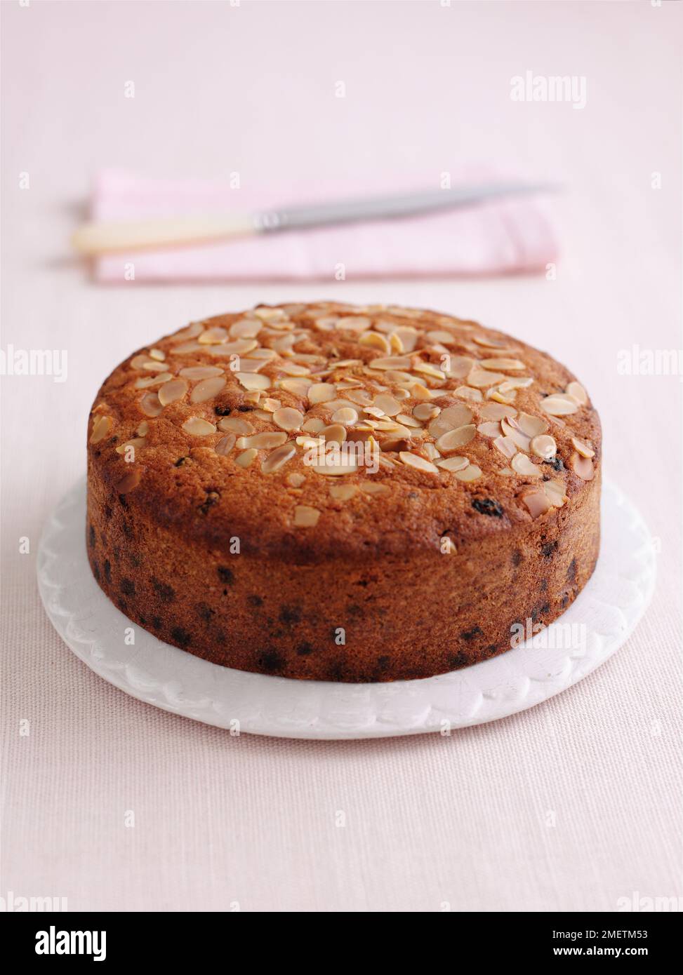 Fruit cake topped with almond flakes Stock Photo Alamy