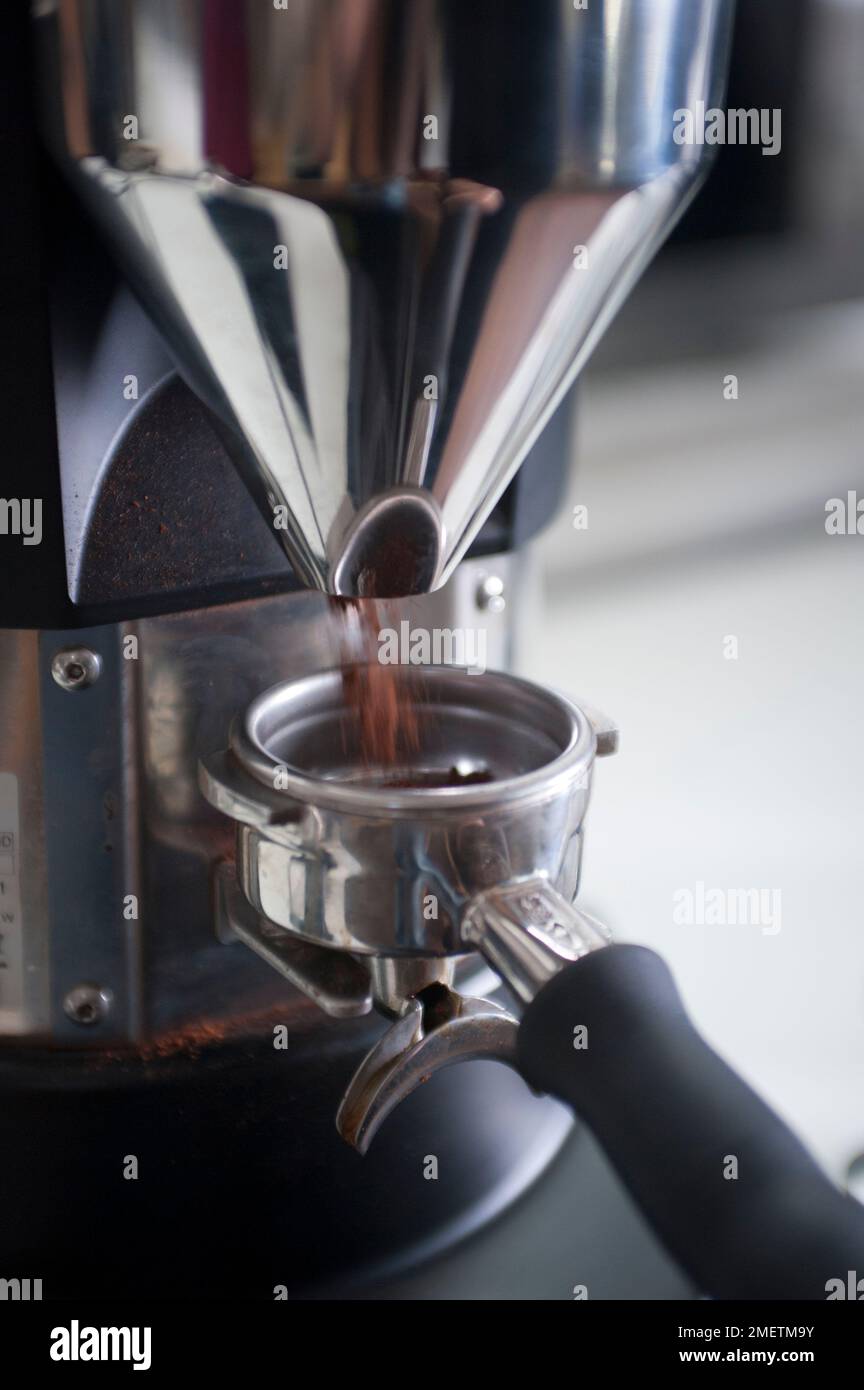 Filling portafilter basket with ground coffee Stock Photo Alamy