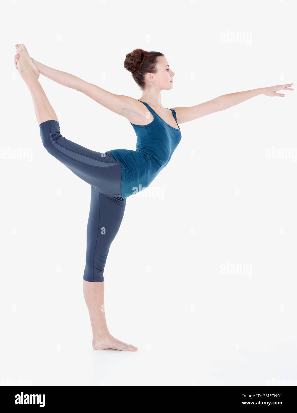 Woman doing gymnastics exercise Stock Photo