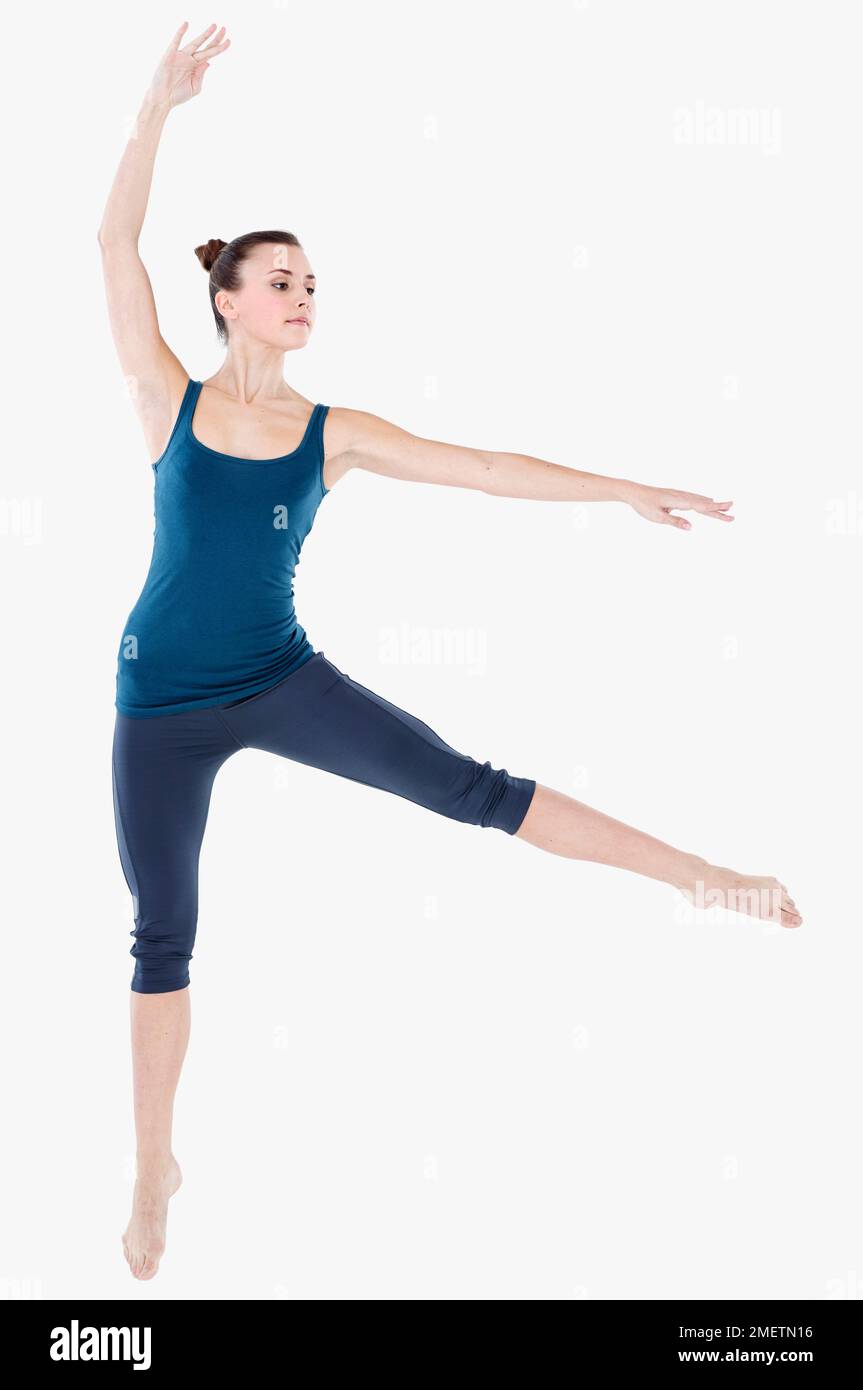 Woman doing gymnastics exercise Stock Photo - Alamy