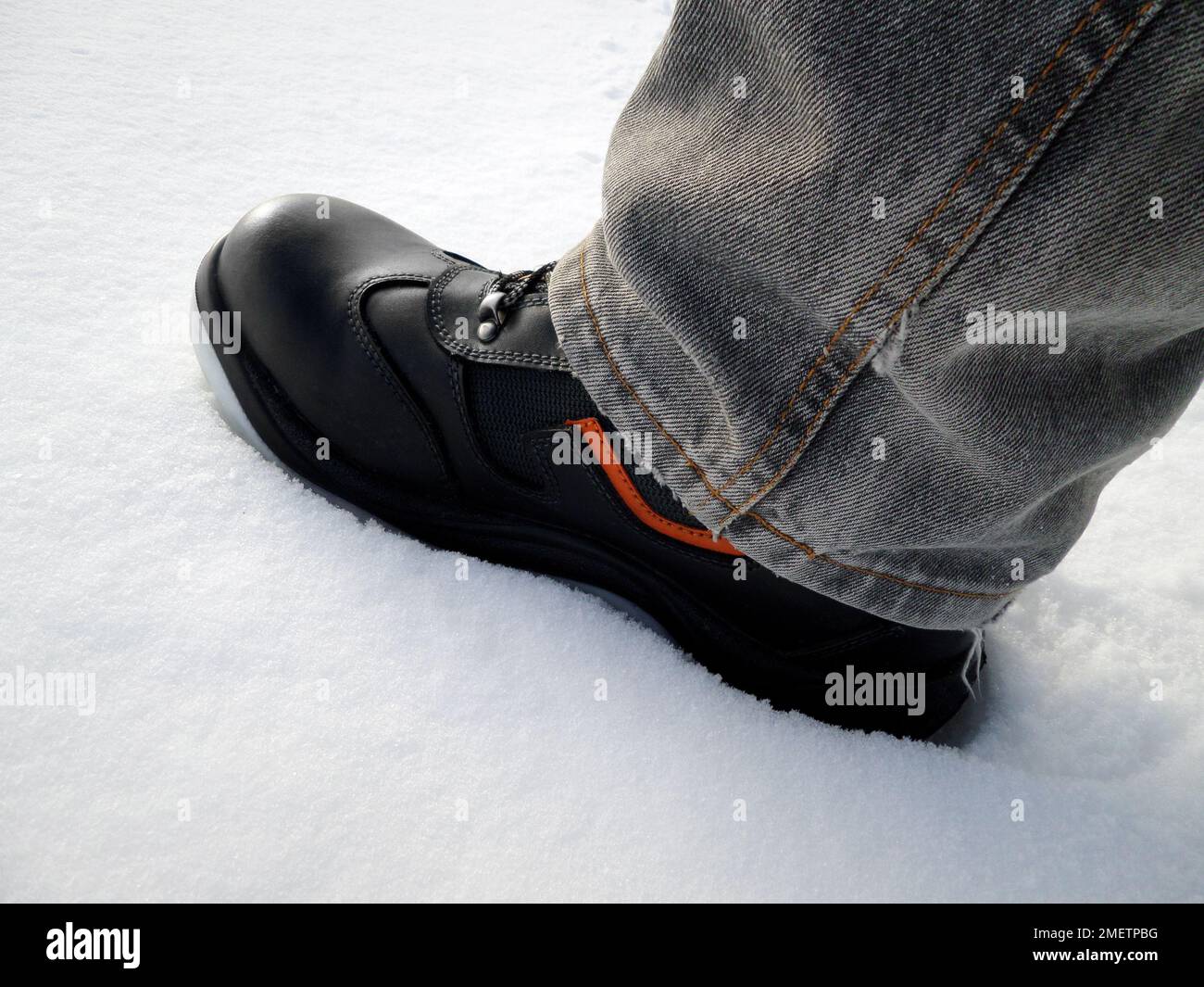 Special boots in the snow. Close-up on a background of snow. Stock Photo