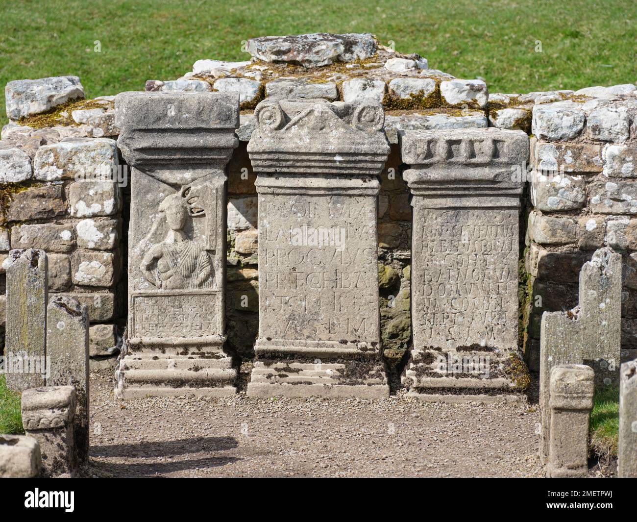 The altar stones in the Mithraic temple of Brocolitia along the route of Hadrian's Wall in the Northumberland National Park, England Stock Photo