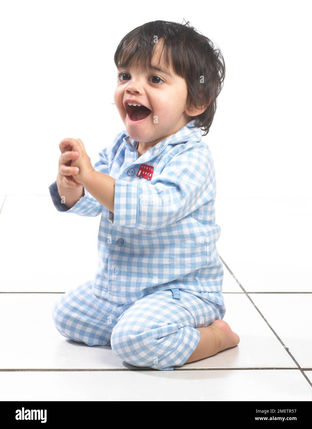 Small boy (16 months) wearing pyjamas Stock Photo