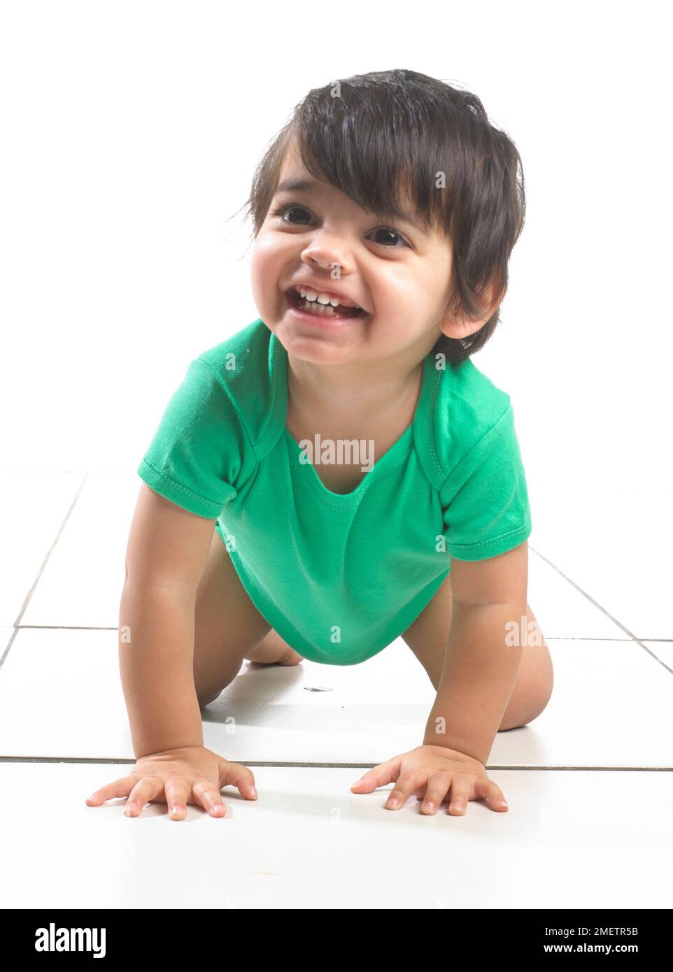 Baby boy (16 months) crawling Stock Photo