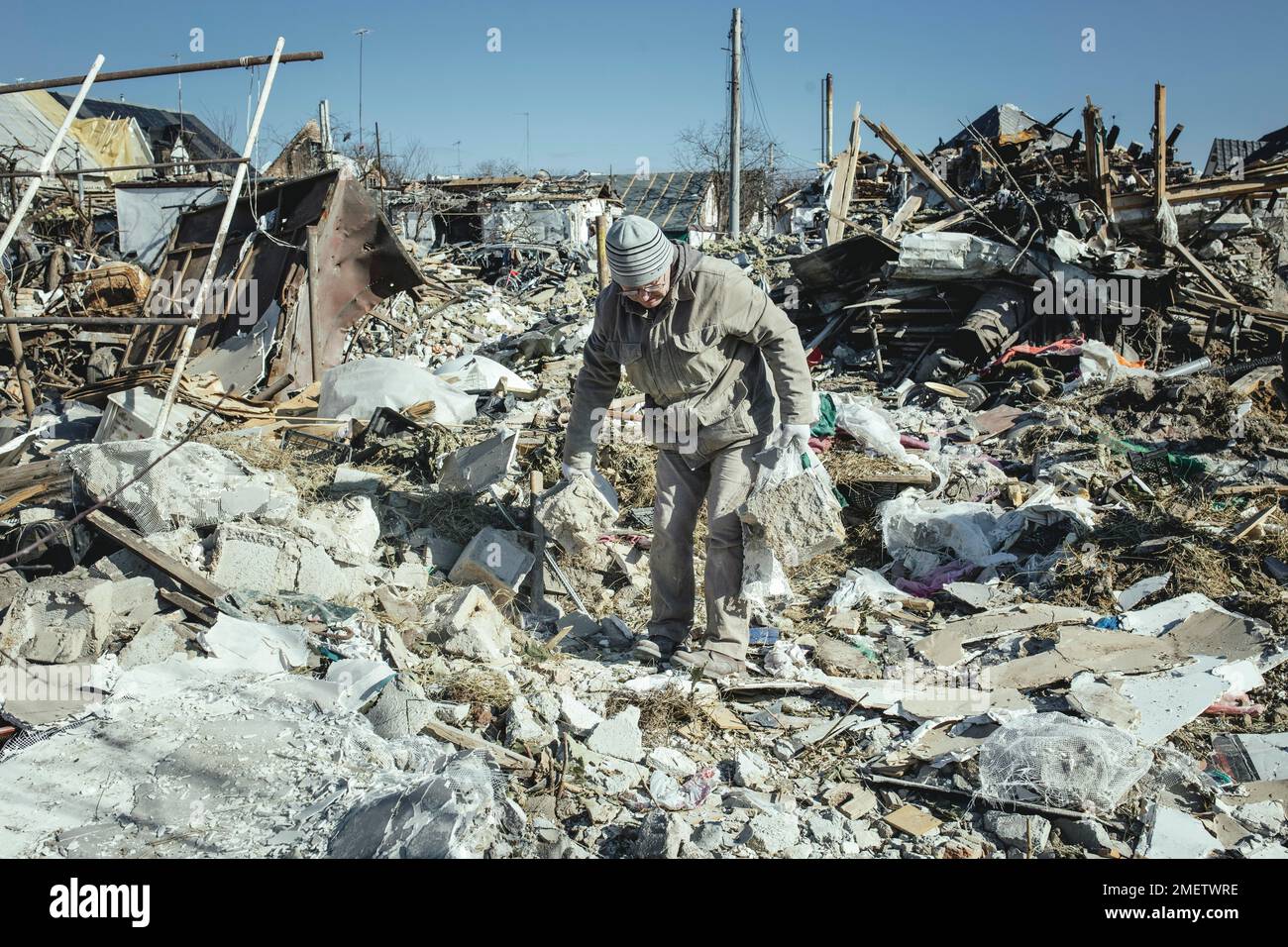 Cleaning up the ruins of the Bohunia residential district, it was destroyed by a Russian missile attack on the night of 1 to 2 March 2022, the attack Stock Photo
