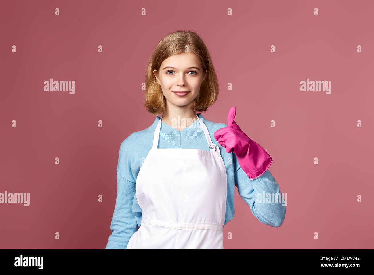 woman in rubber gloves and cleaner apron showing ok sign Stock Photo ...
