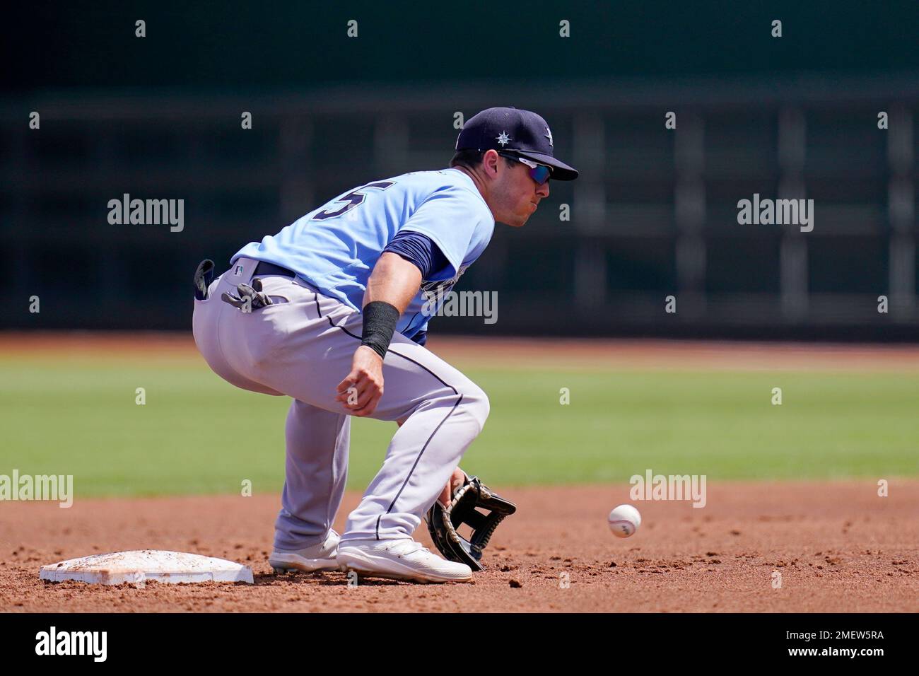 Seattle Mariners second baseman Dylan Moore takes a throw down to