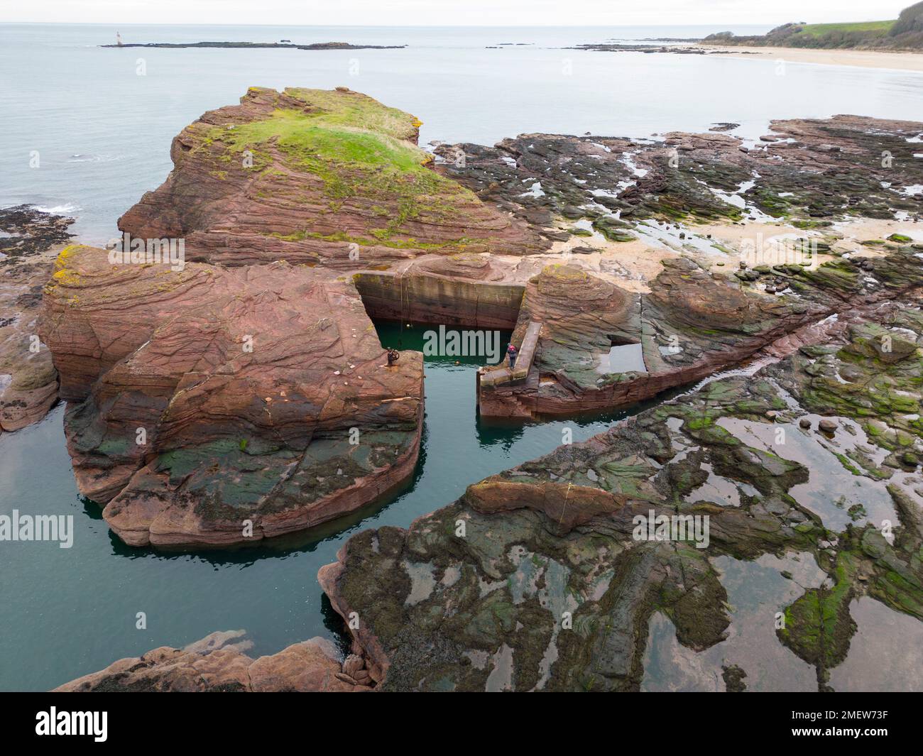 Aerial view looking down on Seacliff harbour carved out of rock near North Berwick  in East Lothian, Scotland UK Stock Photo