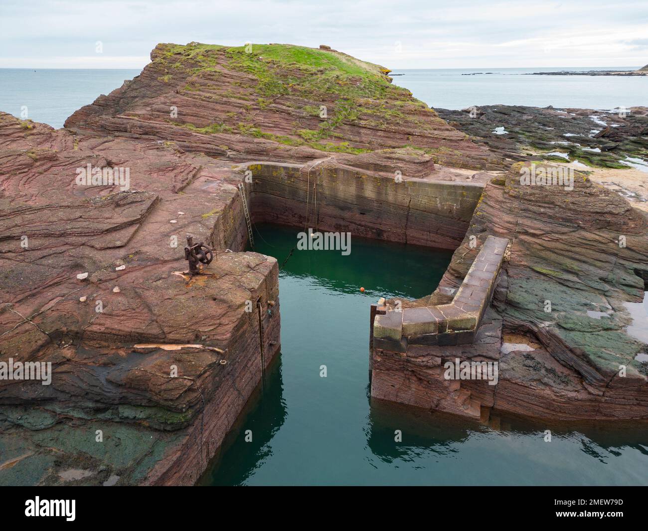 Aerial view looking down on Seacliff harbour carved out of rock near North Berwick  in East Lothian, Scotland UK Stock Photo