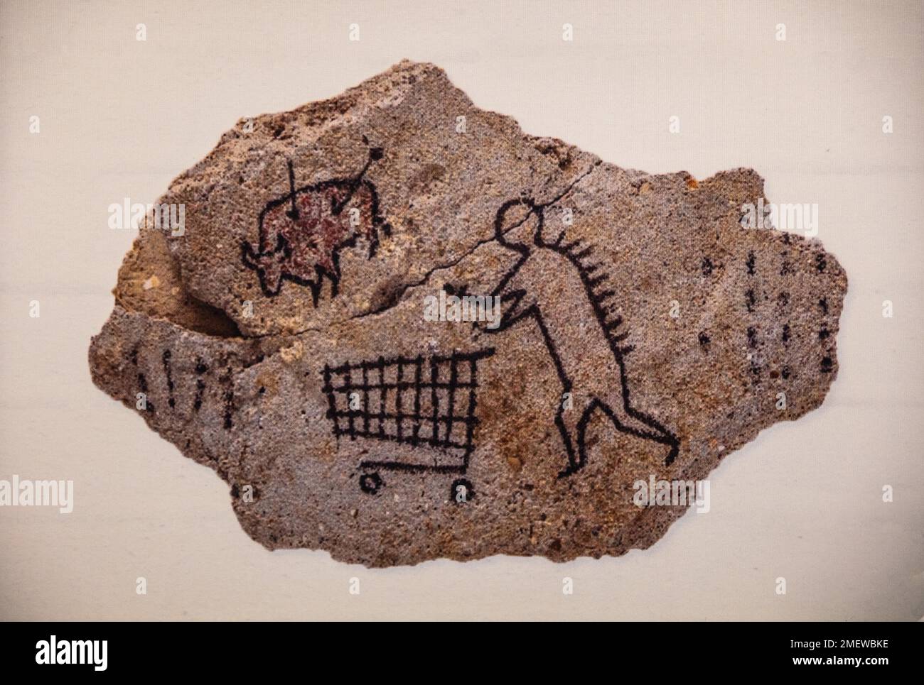 Banksys version of a primitive cave painting on the prowl with a shopping trolley, 2005, exhibition on the street artist, Muelheim, Germany Stock Photo