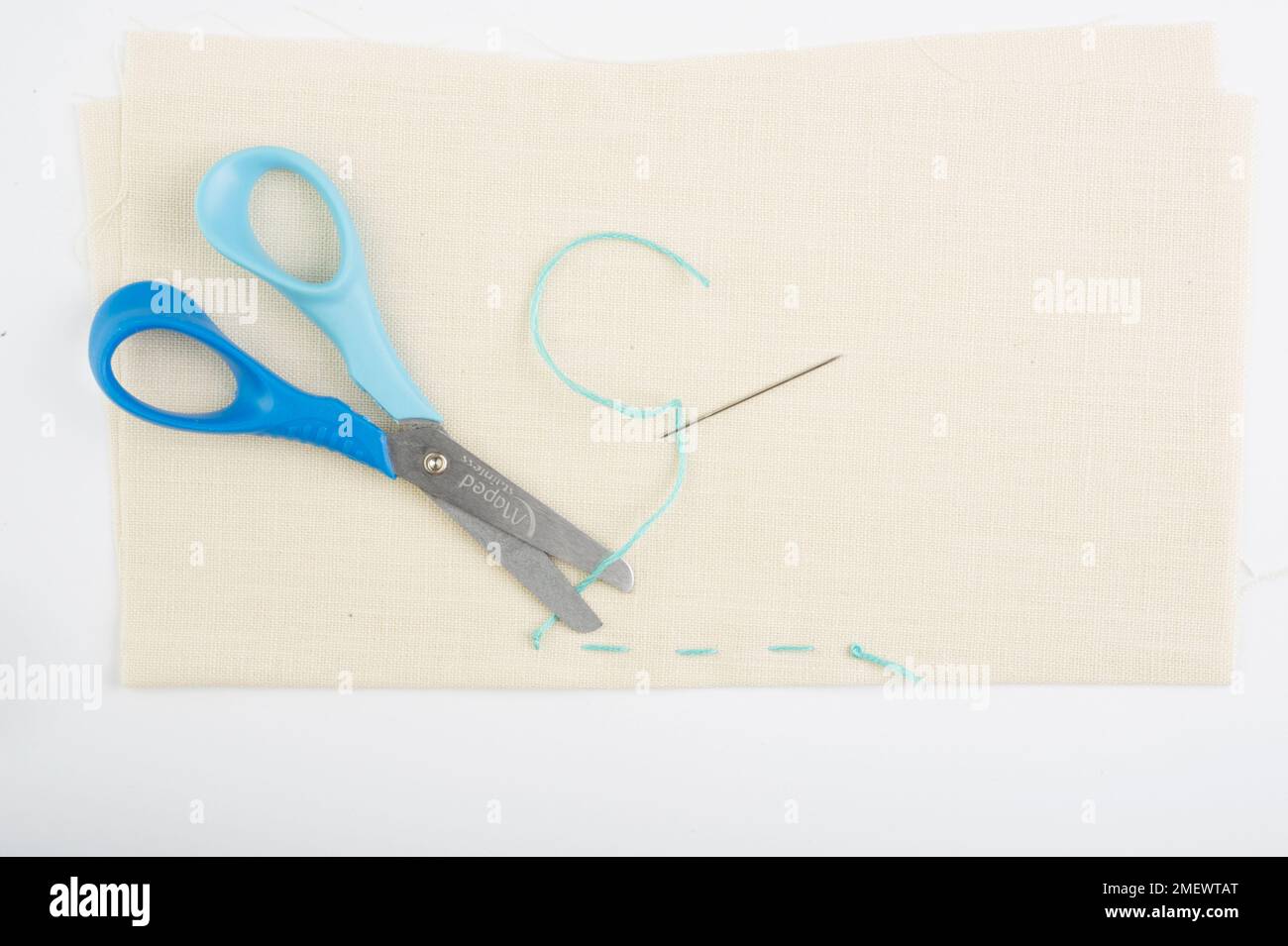 finishing off running stitch with a knot Stock Photo Alamy