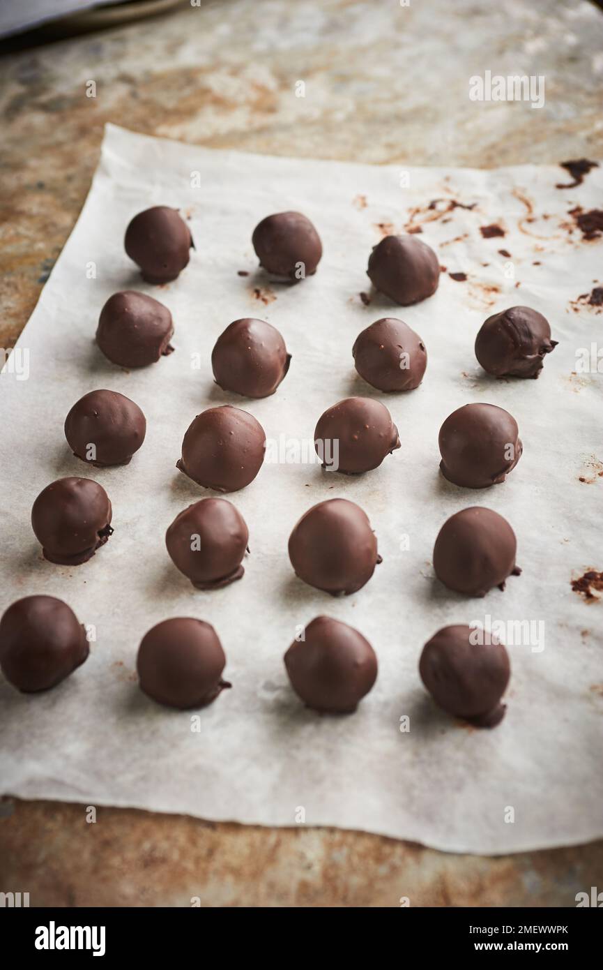 Rolling and dipping truffles Stock Photo