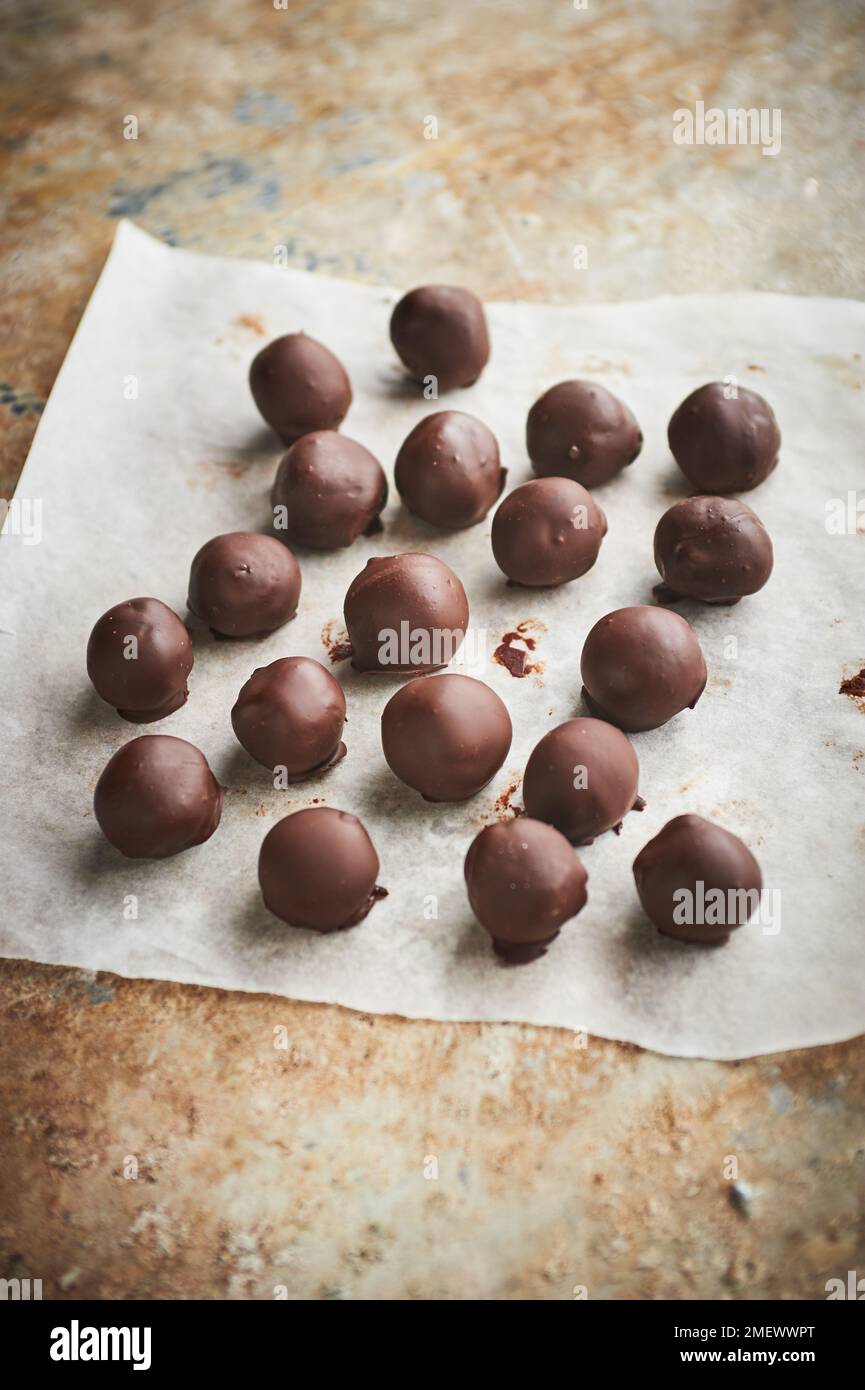 Rolling and dipping truffles Stock Photo