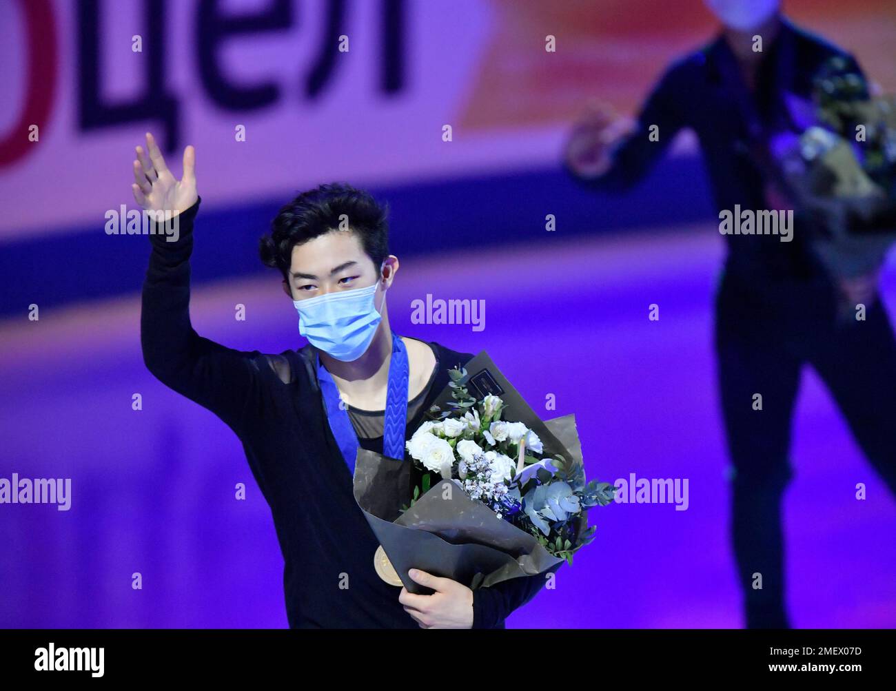 Nathan Chen of the USA stands on the podium after winning the gold