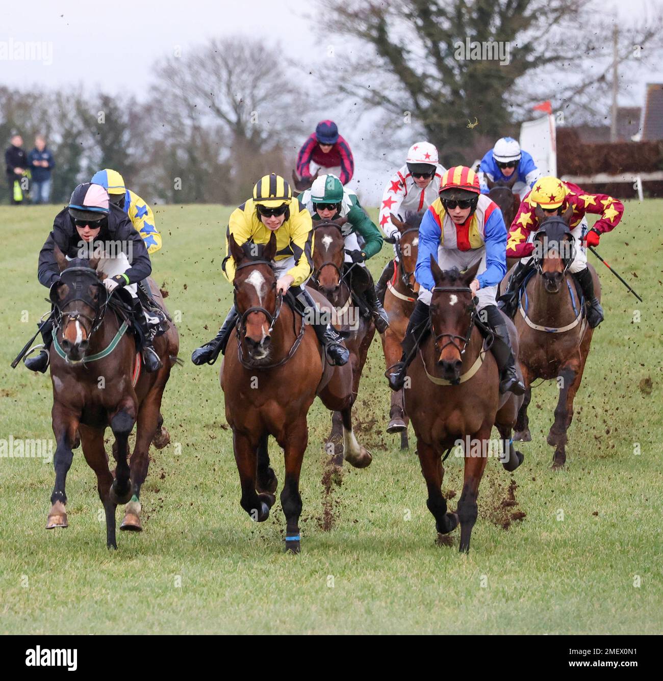 Down Royal Racecourse, Lisburn, Northern Ireland, UK. 24 Jan 2023. Aspall Handicap Chase. National Hunt racing January 2023. Race won by Wee Small Hours (11 – red/yellow helmet) ridden by  jockey Dillon Maxwell, trainer M M Rice. Front three (l-r) Monoxide, Garri Phaidin, and Wee Small Hours. Credit: CAZIMB/Alamy Live News. Stock Photo