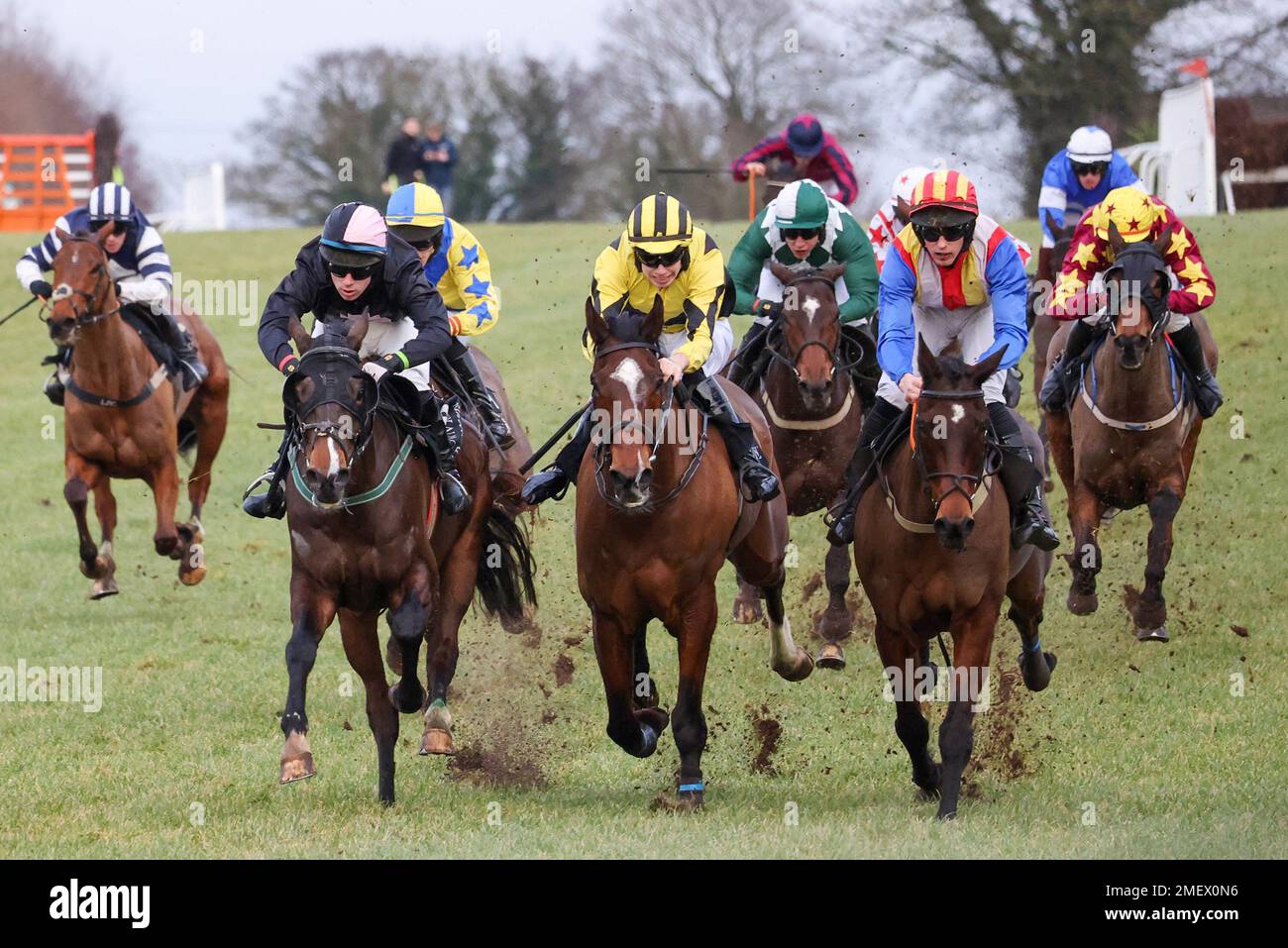 Down Royal Racecourse, Lisburn, Northern Ireland, UK. 24 Jan 2023. Aspall Handicap Chase. National Hunt racing January 2023. Race won by Wee Small Hours (11 – red/yellow helmet) ridden by  jockey Dillon Maxwell, trainer M M Rice. Front three (l-r) Monoxide, Garri Phaidin, and Wee Small Hours. Credit: CAZIMB/Alamy Live News. Stock Photo