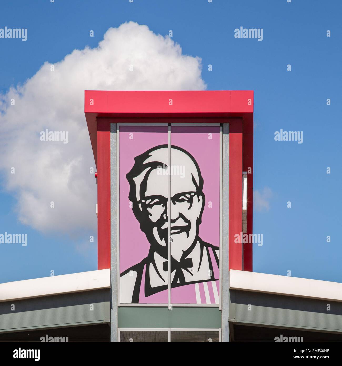 Colonel Sanders artwork featured on a KFC fast food restaurant. Kentucky Fried Chicken. Fast food, diet, healthy eating concept. Stock Photo