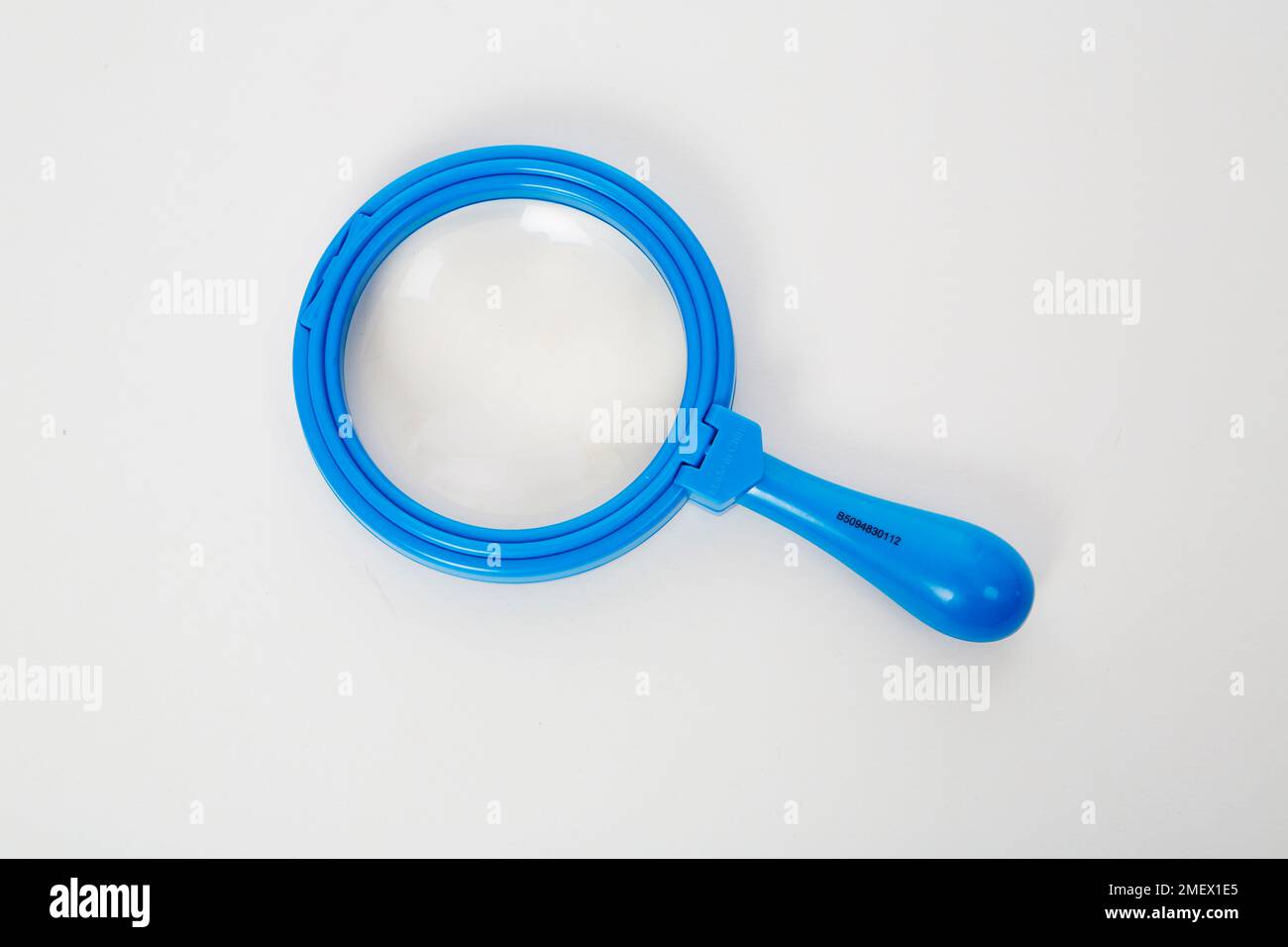 Blue magnifying glass Stock Photo - Alamy