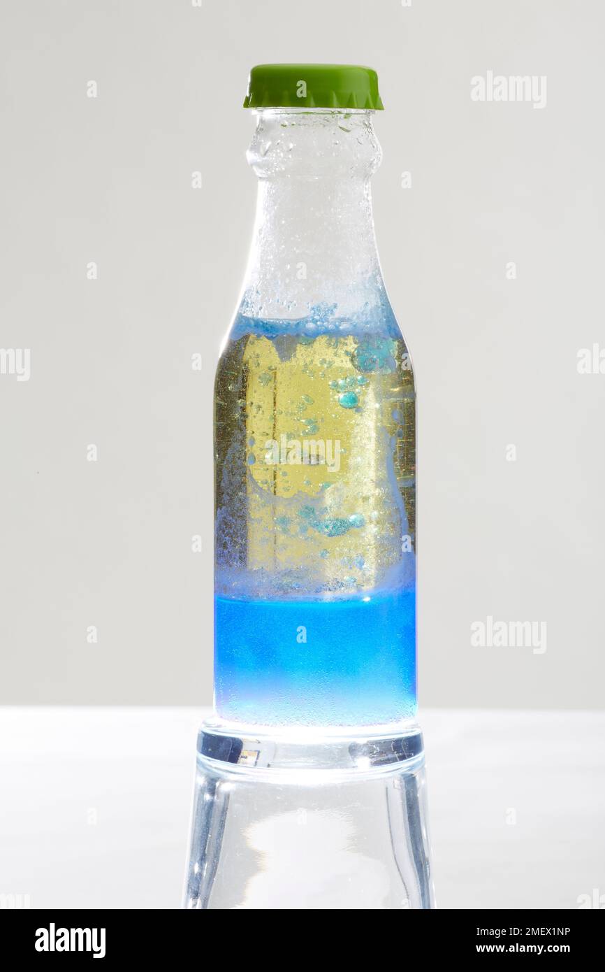 Lava bottle made of washing up liquid and food colouring Stock Photo