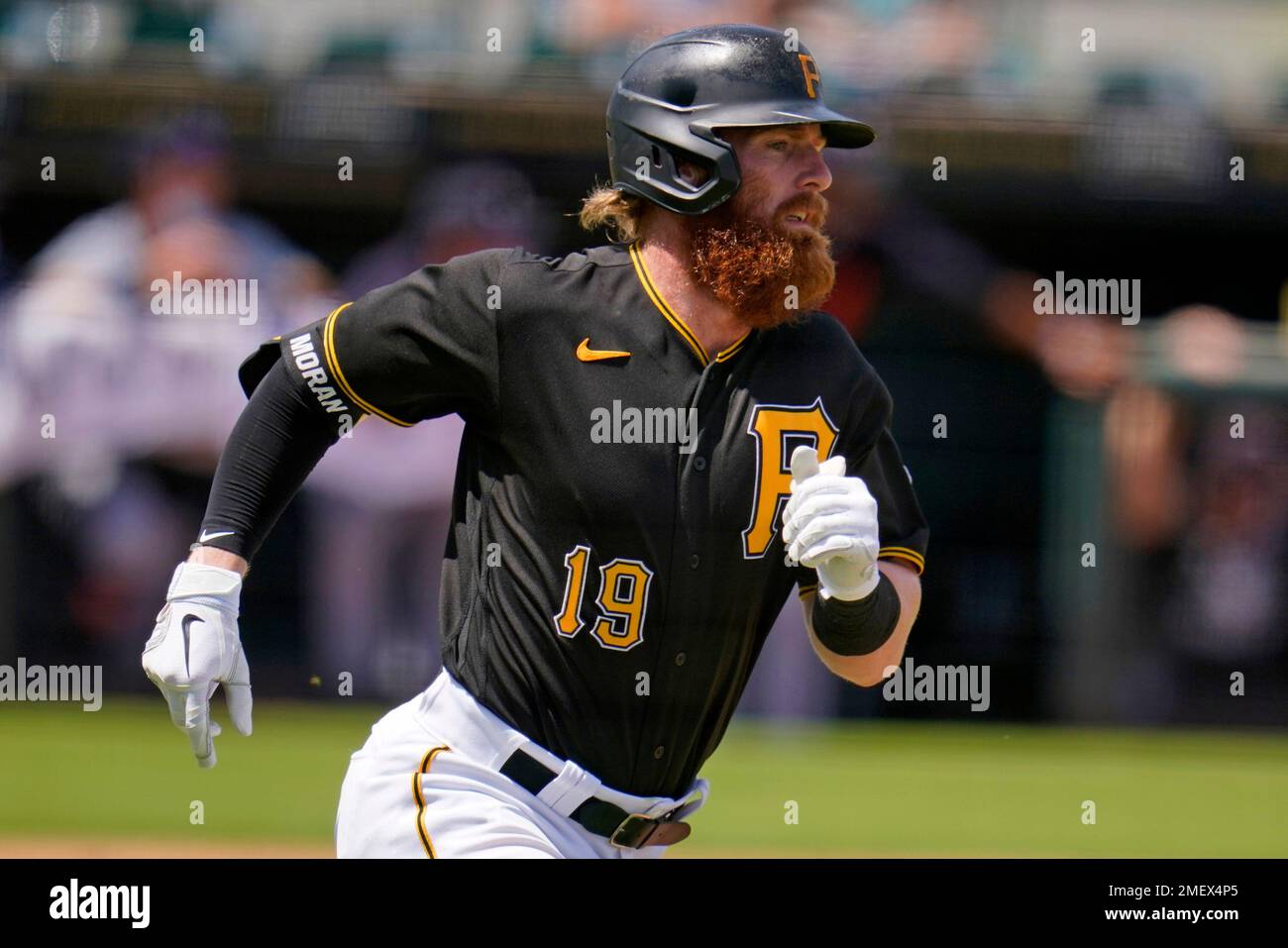 Pittsburgh Pirates' Colin Moran rounds first base after hitting a two