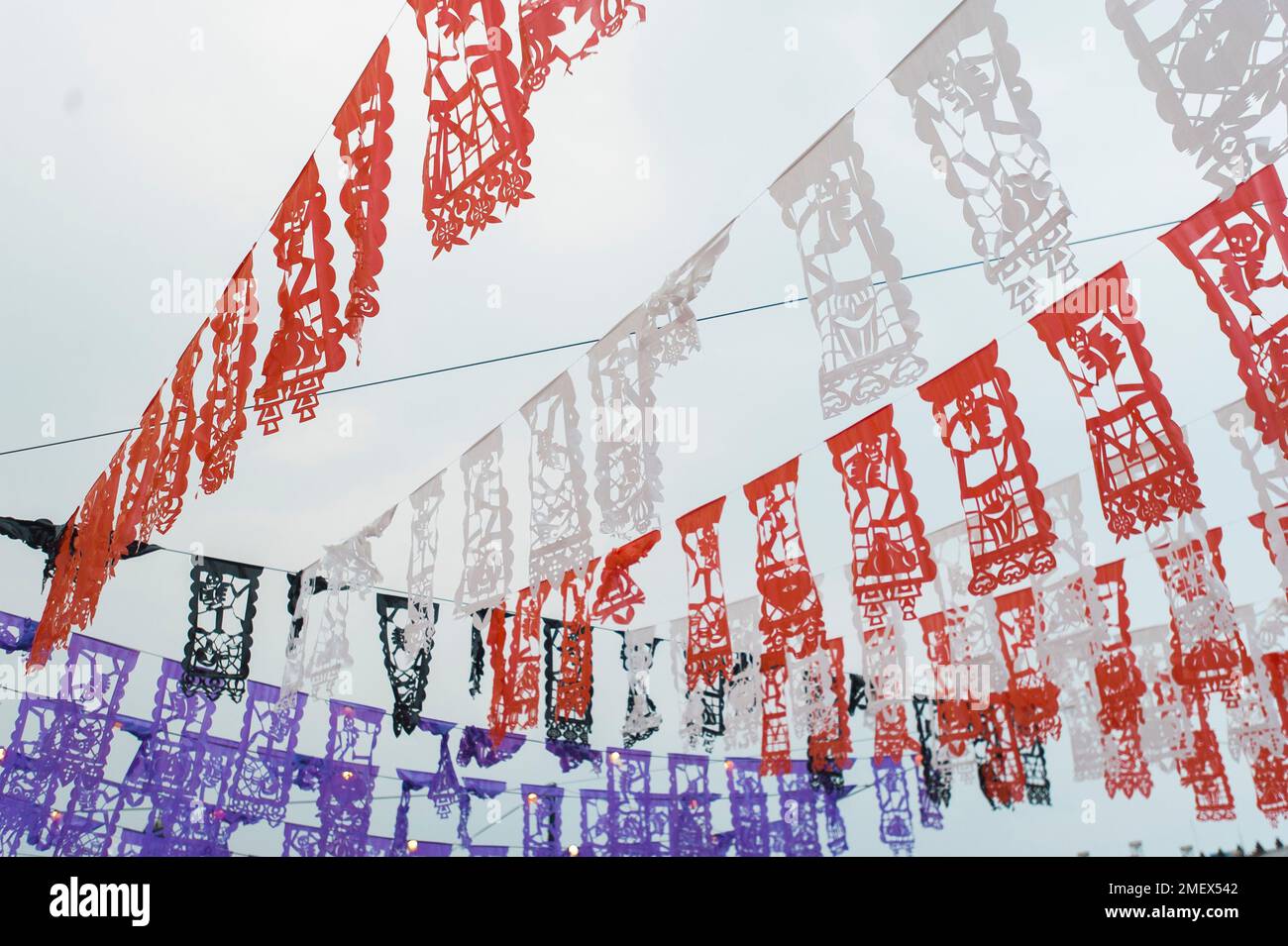 Skeleton decorations hanging over the Day of the Dead parade in Merida, Mexico. Stock Photo