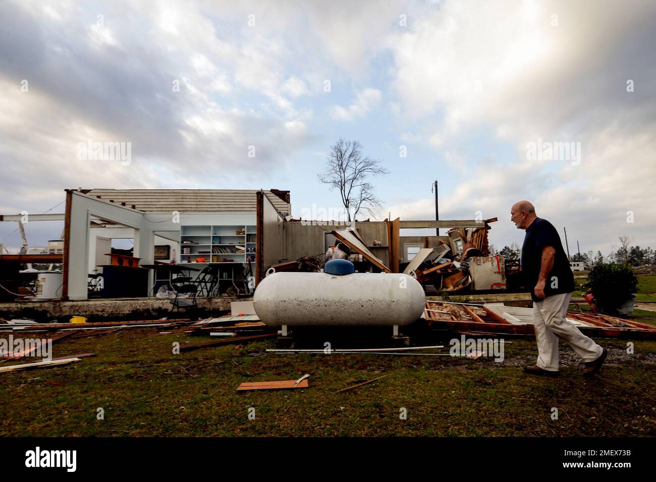 Pastor Danny Poss surveys damage at the Ragan Chapel United Methodist