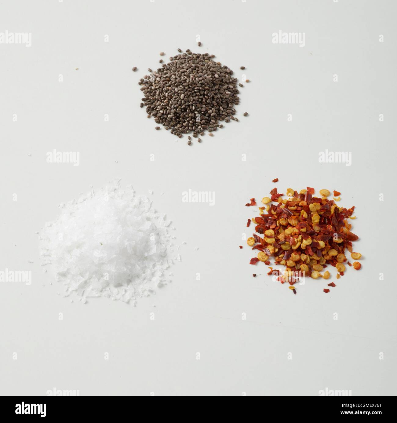 Salt, chia seeds and chilli flakes Stock Photo Alamy