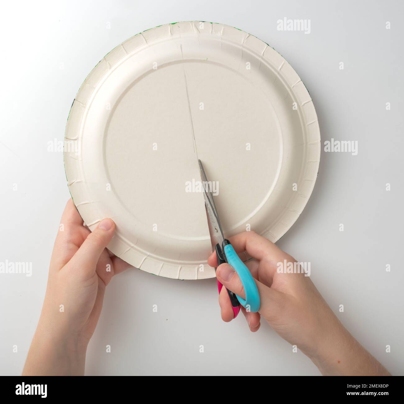 Cutting paper plate in half Stock Photo Alamy