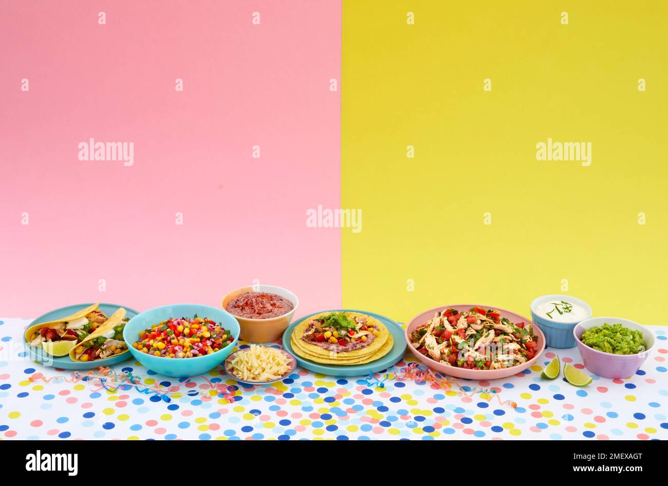 Taco feast spread tacos, chicken bean dip, cheese, guacamole, sour cream Stock Photo Alamy