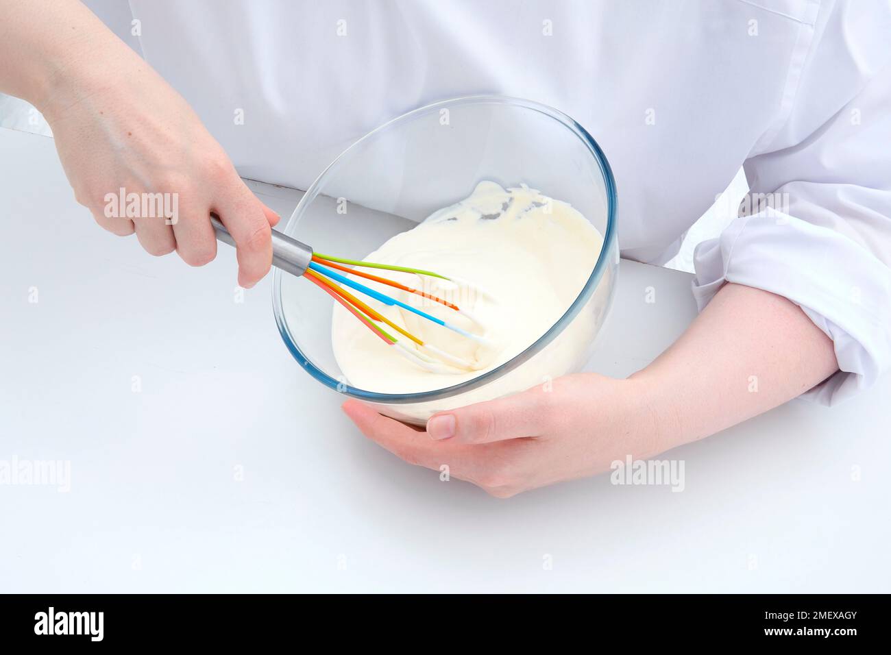 Cooking techniques Hand whisking cream Stock Photo Alamy