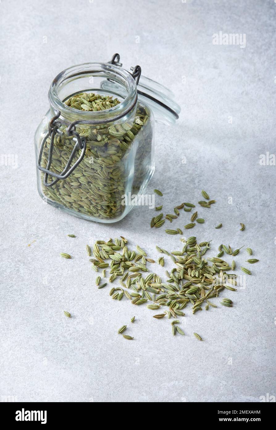 Natural Menopause Remedies Photos fennel seeds pile and jar Stock Photo