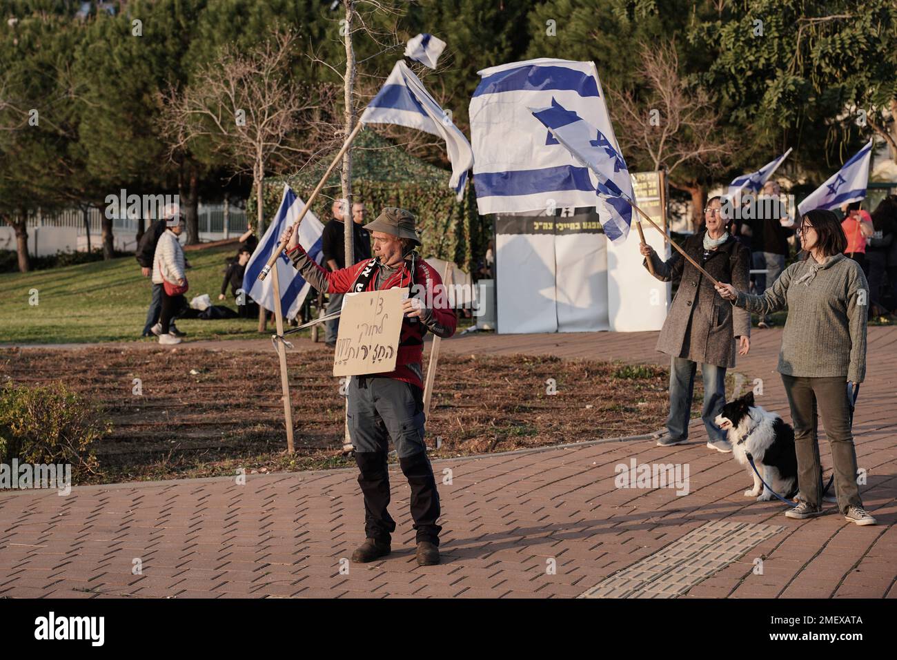 Modiin, Israel. 24th Jan, 2023. Activists demonstrate outside the home of Minister of Justice, Yariv Levin, against proposed legislation to overhaul the judiciary system giving Netanyahu's government a path to override court decisions. Levin leads proposed legislation which many perceive could undermine the foundations of democracy, undermine the independence of the judicial and law enforcement, upset the balances between the state and religion and individual rights and deepen social polarization in Israel, all for the sake of providing Netanyahu judicial immunity or cancellation of his corrup Stock Photo