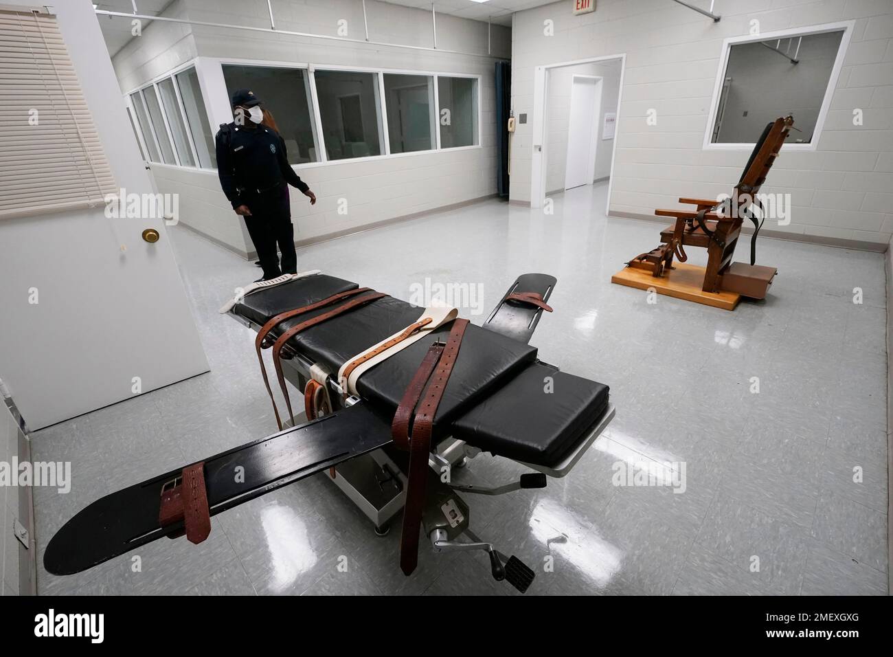 A guard stands in the death chamber with the gurney and electric chair