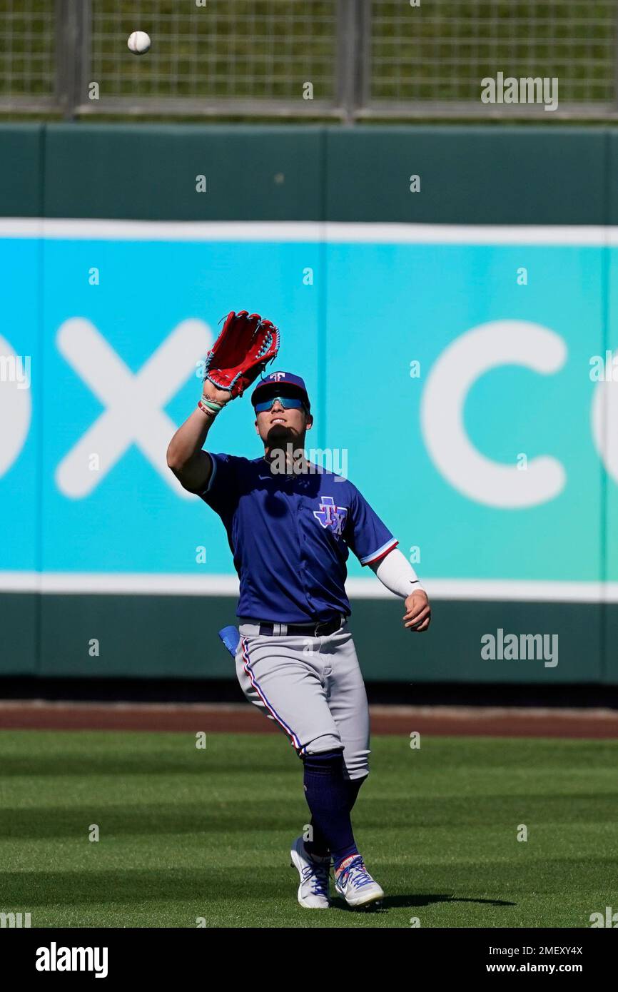 Texas Rangers outfielder Steele Walker catches a fly ball hit by