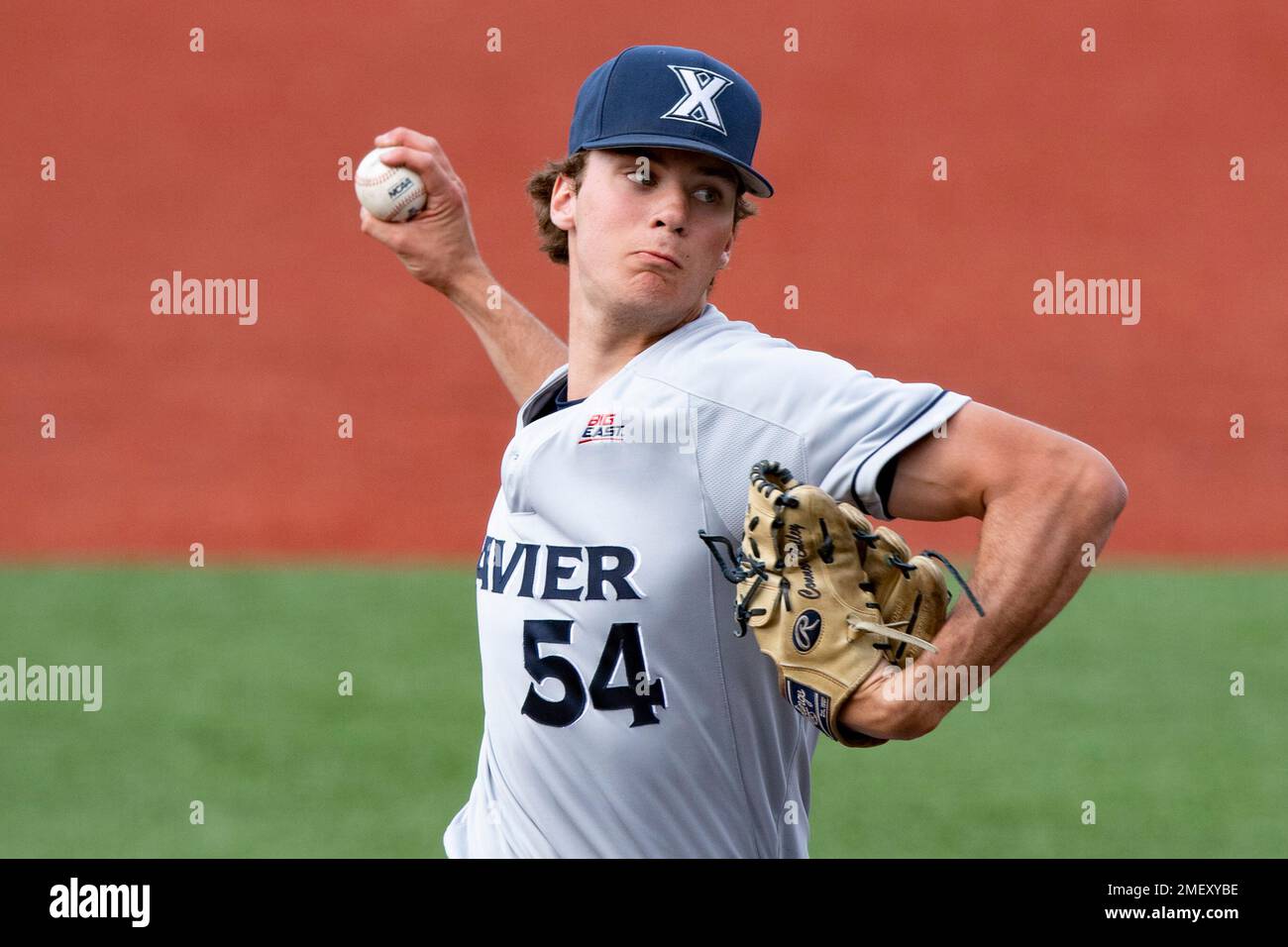 Connor Bailey (54) of Xavier delivers a pitch during an NCAA baseball ...